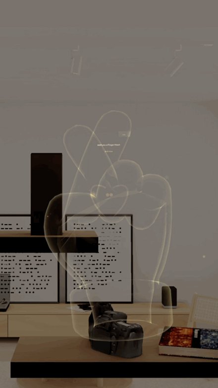 A holographic Finger Heart gesture waiting in the Specs wearer’s environment